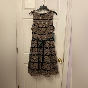 Black and gold scalloped sequin dress with satin belt